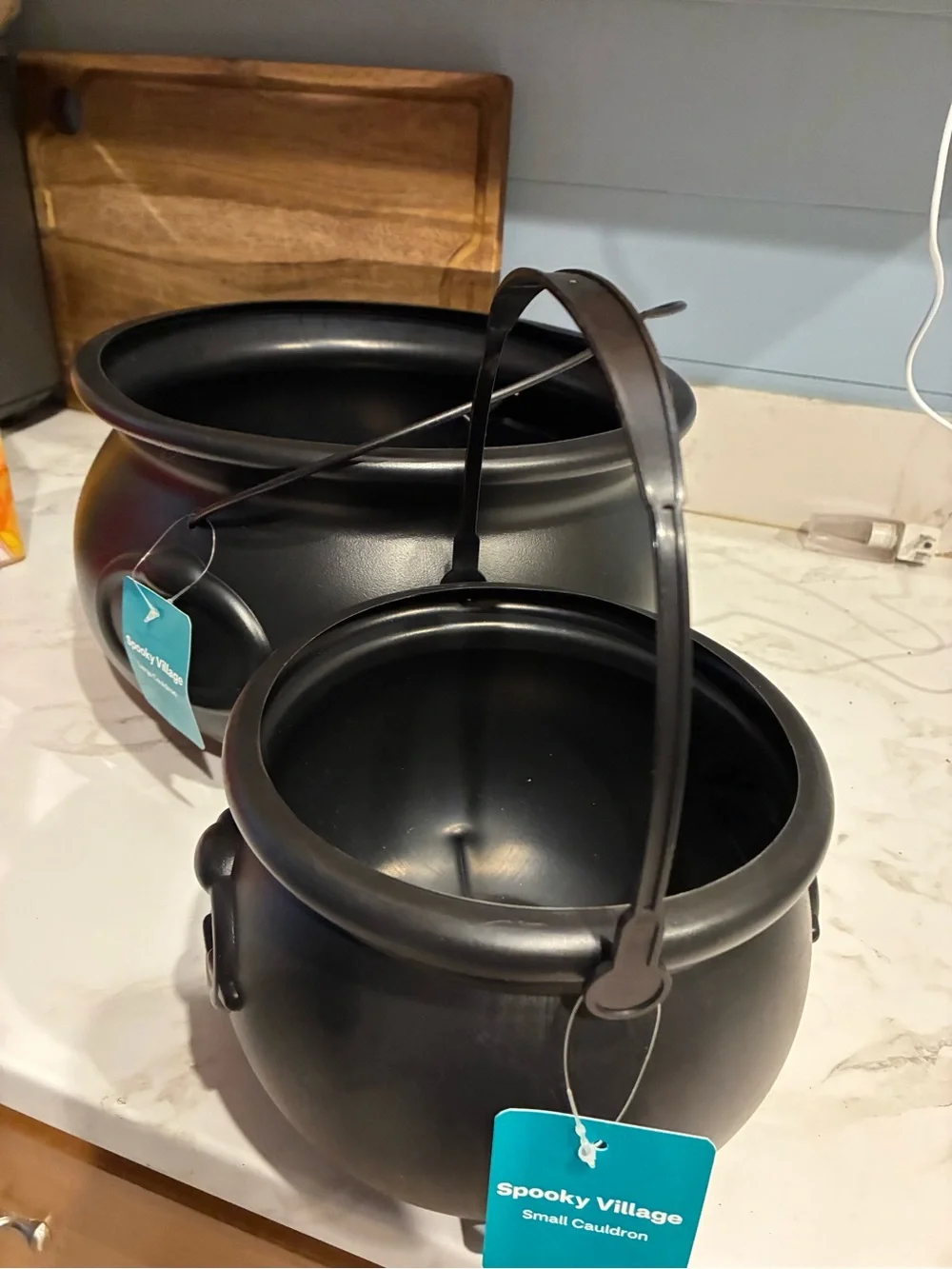 Two new black cauldrons 12.6” x7” largest